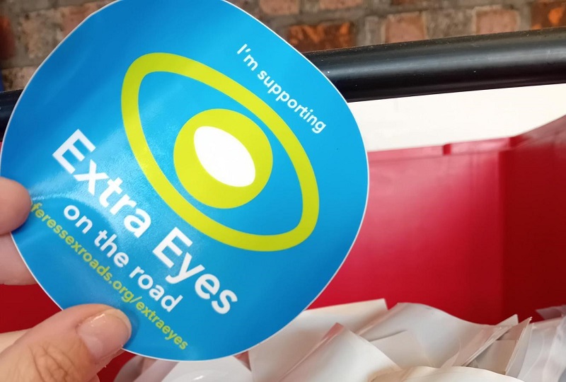 Stickers promoting the Extra Eyes initiative